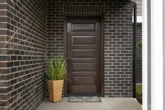 Elegant covered entry with newly sealed door