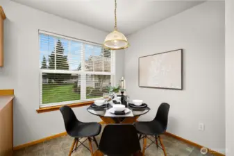 Eat-in dining area just off the kitchen is bathed in sunlight and is a great place to enjoy a morning cup of coffee.