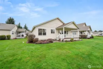Lush lawn welcomes you just off the back deck.