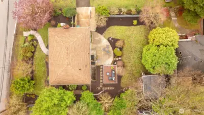 7,500 sq ft lot with two patios and potting shed.