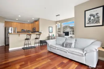 Convenient eating bar area opens up to main living room offers a wonderful space to entertain friends or family...