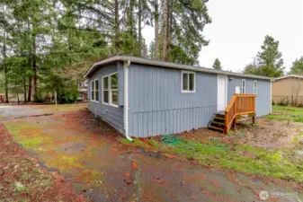 Backdoor entry also, directly off kitchen & paved front driveway parking.