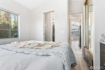 Functional bedroom w/built in storage & 2 closets - open to 3/4 bathroom via pocket door