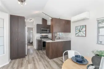 HP split for heating/cooling year-round. Notice extra pantry cabinets