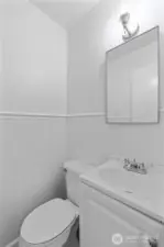 BONUS BATHROOM | Located off the mudroom this half-bathroom is a welcome addition to the functionality of the home.