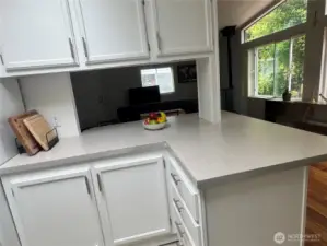 This view of the kitchen shows the Luxury Vinyl Plank floors.