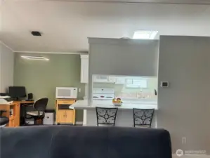 The kitchen and dining room/office, as seen from the living room.
