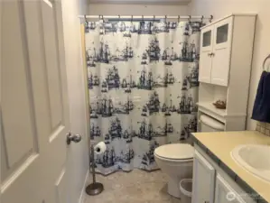 The second bathroom is roomy and light-filled. It has a soaking tub for relaxing long soaks and a shower for quick, hot showers.