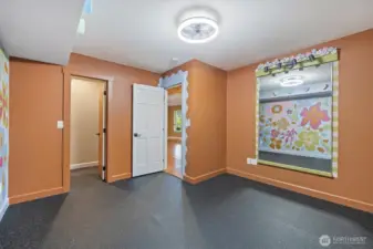 Endless possibilities in this versatile bedroom—perfect for a gym, office, or playroom.