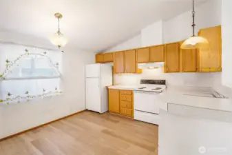 The kitchen is roomy enough for a table and chairs. The refrigerator space can hold an even larger refrigerator if you'd like!