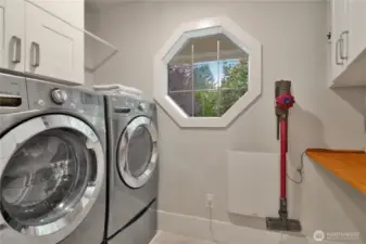 Designed for efficiency—keep chores simple in this practical utility room on the main level