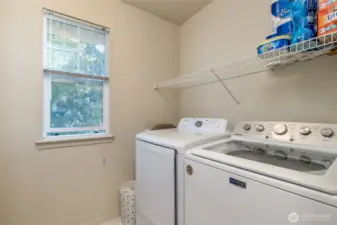Laundry room conveniently located upstairs
