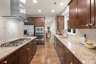 This kitchen is a dream for cooking and baking! So much counterspace, gas cooking, storage, and a pantry.