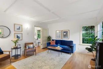 Charming living room with original wood floors!