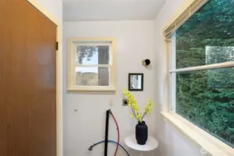 Eastern view and hook ups for a main floor washer dryer