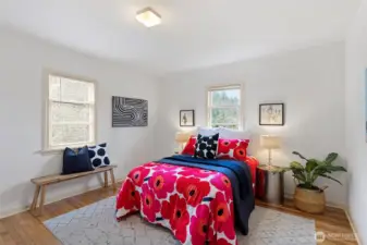 Primary bedroom with wood floors