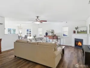 large open concept living room w/ fireplace