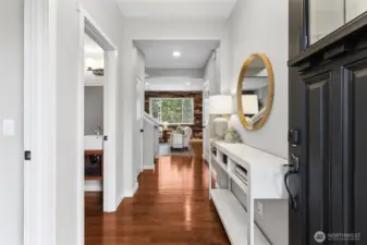 Beautiful entryway showcases gleaming hardwood floors and the territorial view from the living area.