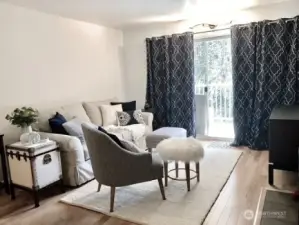 Comfortable sized livingroom with expansive sliders leading to private deck with beautiful views. Real hardwood floors bring an upscale feel to this space. Wood fireplace for those cool winter nights.