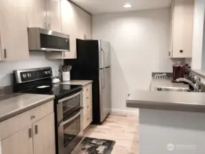 Kitchen is open to greatrooom which allows good natural light excellent entertaining space and views to the back deck