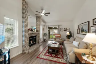 Family Room with Fireplace and slider to back Deck and Fenced Backyard