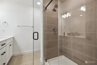 Primary bath shower  Model home- colors and finishes may vary