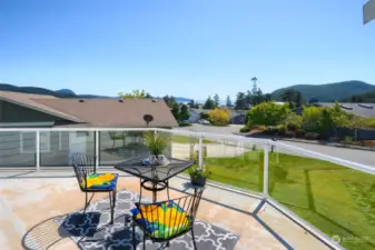 Step out onto the large deck with views of the bay and islands. Great place to enjoy a nice cup of coffee in the mornings or view the sunset over the islands.