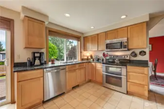 Beautiful kitchen overlooking amazing backyard