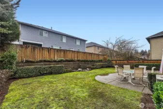 The backyard is fully fenced for added privacy.