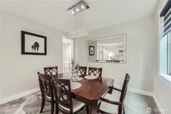 The formal dining room is outfitted with a window to let in the natural light.