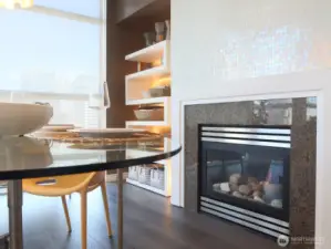 Enjoy a nice dinner right next to the beautifully refinished in Ann Sacks Opalescent Mosaic Tumbled Tile gas fireplace.