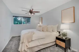 The primary bedroom continues with a neutral palette sure to go with any decor.