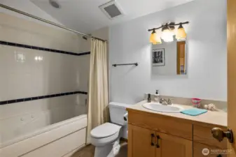 Primary Suite Loft! Jetted tub with tile surround.