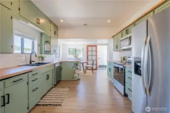 A large kitchen that opens to the side door of the home