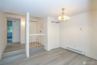 Upon entry, you're greeted by the dining area and a hallway that leads to the bedrooms and bathrooms.