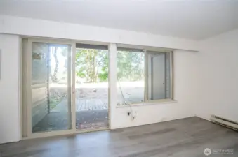 View from the living area overlooking the patio, which includes a private storage closet.