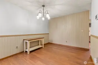 Dining room with kitchen through door to the right