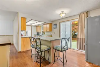 View from hallway into eating nook and kitchen