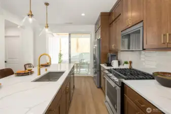 Lots of counter space and gas range offer convenience.