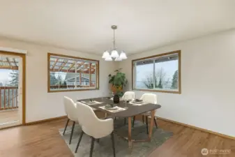 Large dining area adjacent to the kitchen- lots of windows for territorial views with sliding door for easy access to the deck for BBQ'ing.