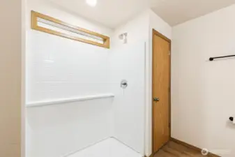 Full sized walk-in shower with linen closet & new LVP flooring.