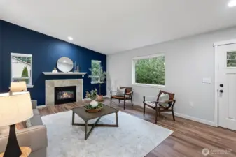 Walk in to living area with a cozy propane gas fireplace