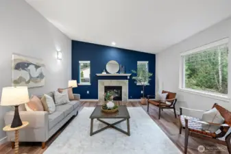 Walk in to living area with a cozy propane gas fireplace