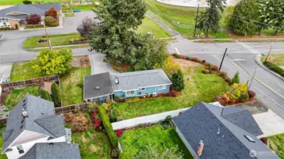 New Roof in 2024~Partially Fenced Corner Lot~Mature Fir Trees & well Established Landscaping