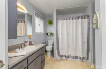 Large Bathroom Includes an "All in One" Washer & Dryer set to Remain with the Home~