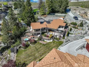 Dramatic aerial perspective showcasing the estate perched above crystal-clear Lake Chelan.