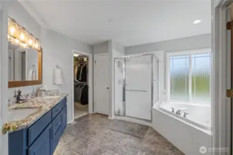 five-piece ensuite with jetted tub, separate shower, and walk-in closet