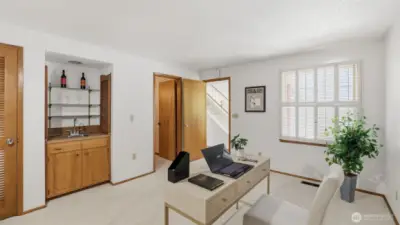 Main level bedroom that features a wet bar.