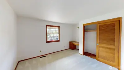 Second guest bedroom on the upper level with a built in desk!