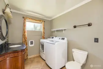 A thoughtfully done 3/4 bath with brand new washer and dryer